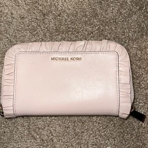 Michael Kors wallet, Baby pink with ruffled hem around it like new hardly used.